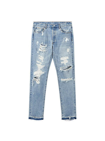 Distressed Washed Retro Light-colored Jeans With Ripped Raw Edges MuddyStock